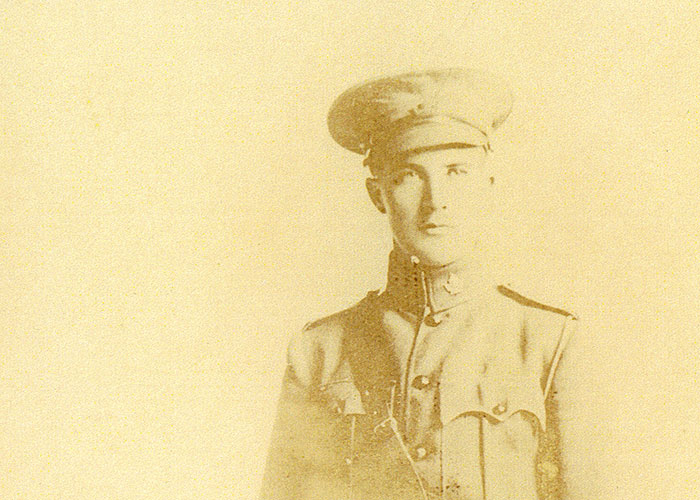 Sepia portrait of a man in a military uniform.
