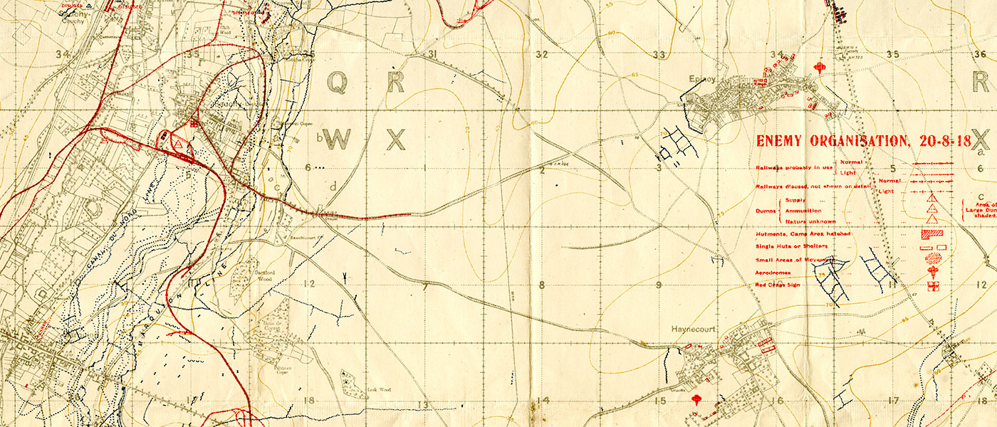 Image is a section of a map of France from the First World War, depicting trench and rail lines, dumps, and built structures.